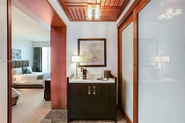 a bathroom with a sink a mirror and vanity