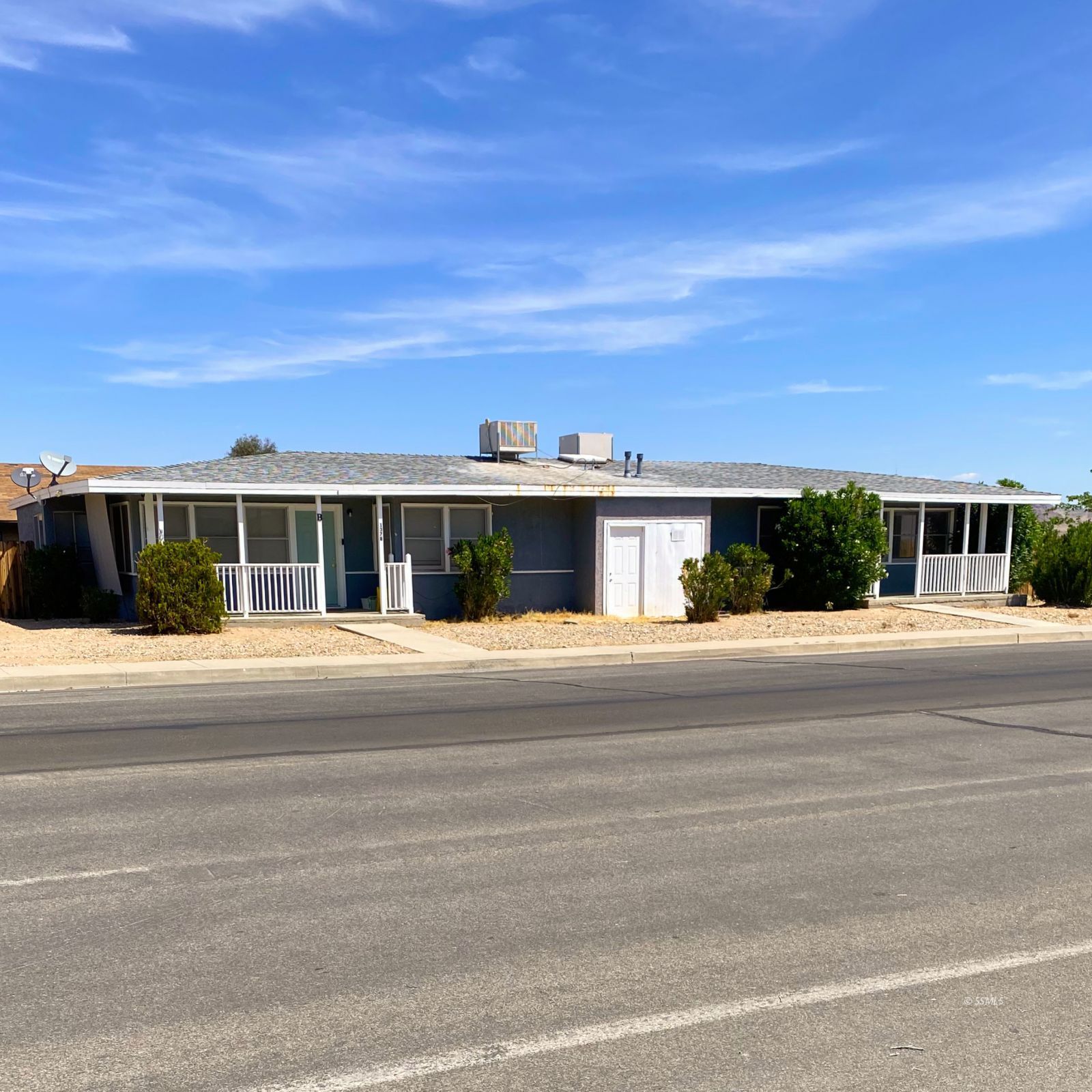 137 South Richmond Road Ridgecrest, CA 93555 - Photo 2 of 31 front view of a house with a yard