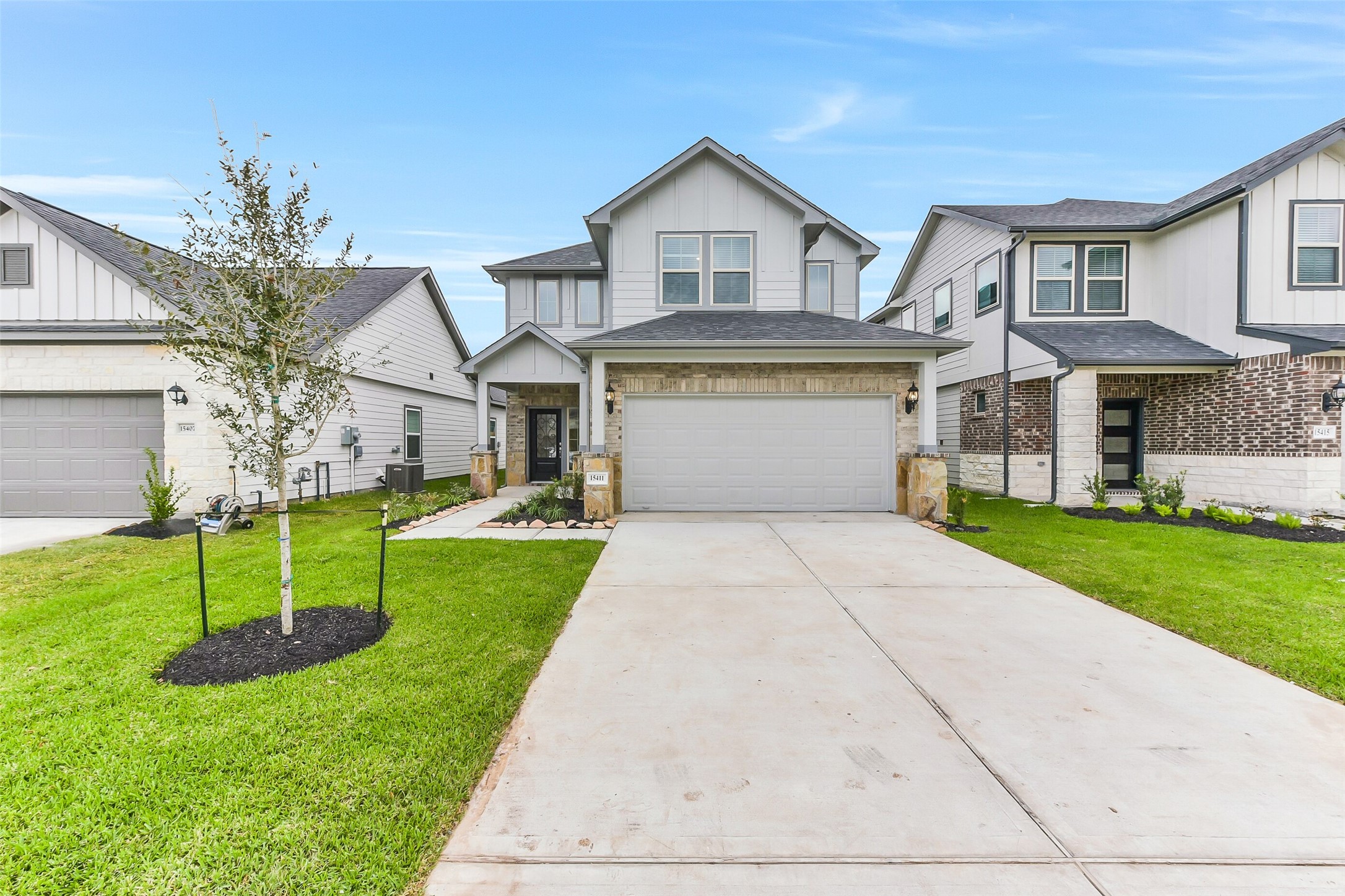 a front view of house with yard and green space