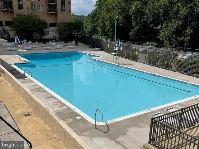 a view of swimming pool with a patio
