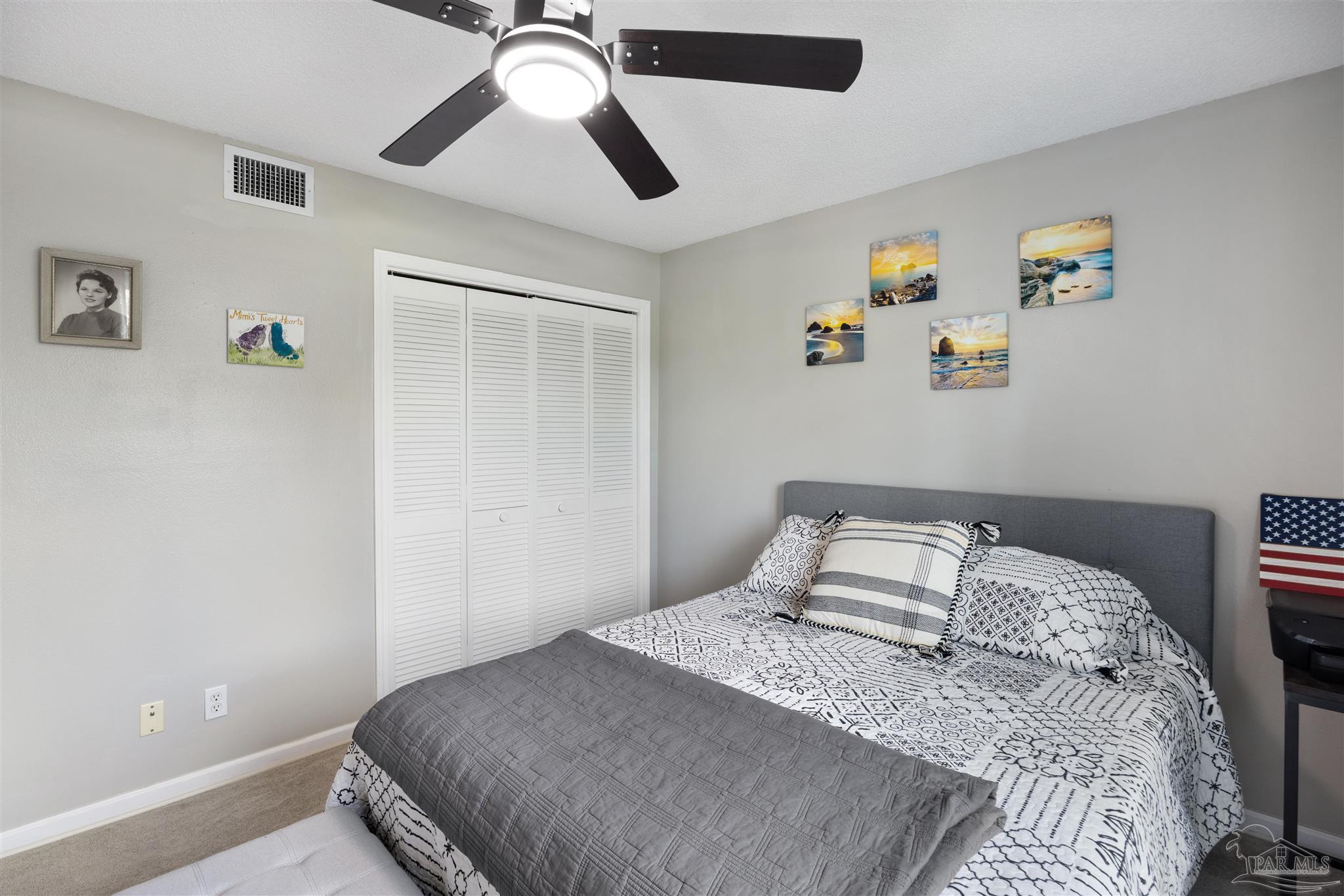 14100 River Road, Unit 122B Perdido Key, FL 32507 - Photo 31 of 46 a bedroom with a bed and a chandelier