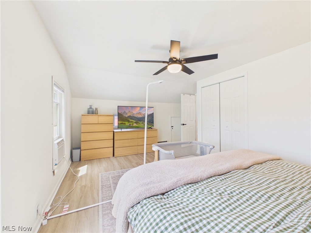 3490 County Line Road Madison, OH 44057 - Photo 30 of 42 Bright room featuring wood-finish flooring, a ceiling fan with integrated lighting, and a window providing natural light