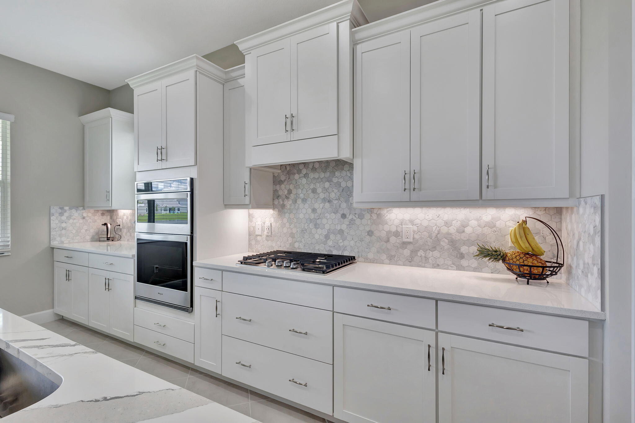 5403 Macoon Way Westlake, FL 33470 - Photo 11 of 51 a kitchen with white cabinets and white appliances