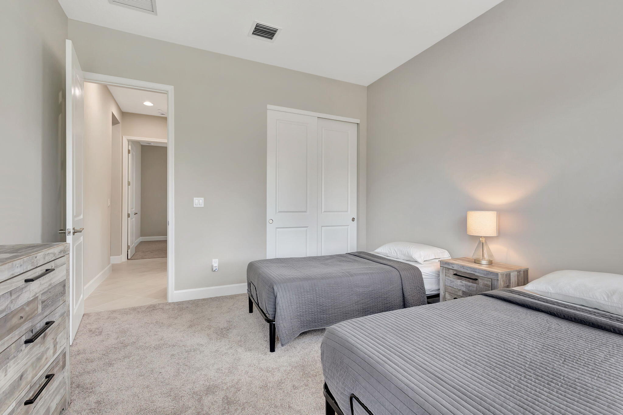 5403 Macoon Way Westlake, FL 33470 - Photo 23 of 51 a bedroom with two beds and painted walls