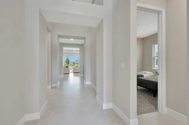 a view of a hallway and a livingroom with a furniture