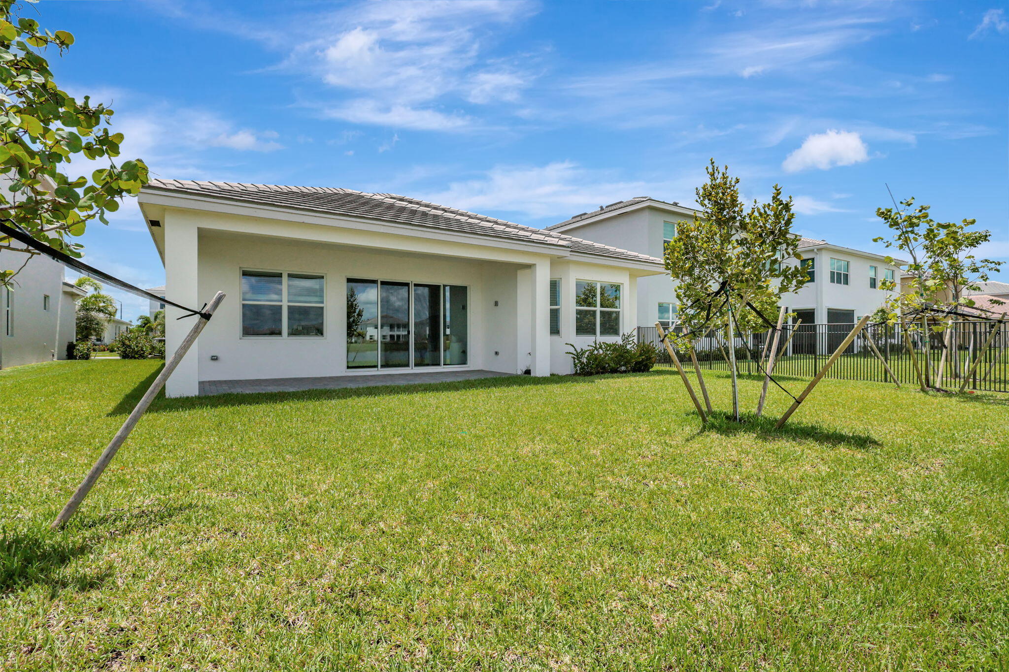 5403 Macoon Way Westlake, FL 33470 - Photo 35 of 51 a view of a house with a swimming pool