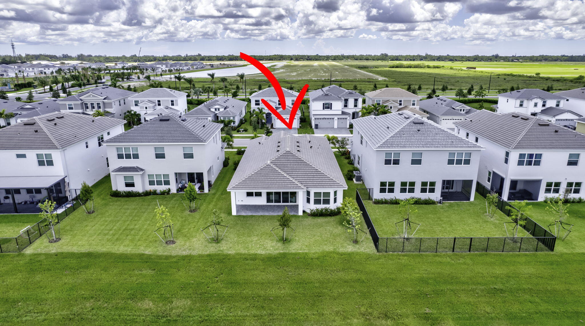 5403 Macoon Way Westlake, FL 33470 - Photo 4 of 51 an aerial view of multiple houses with yard