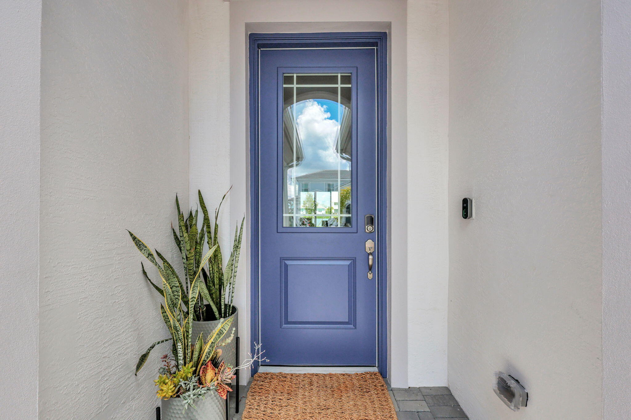 5403 Macoon Way Westlake, FL 33470 - Photo 6 of 51 a view of a hallway with a potted plant