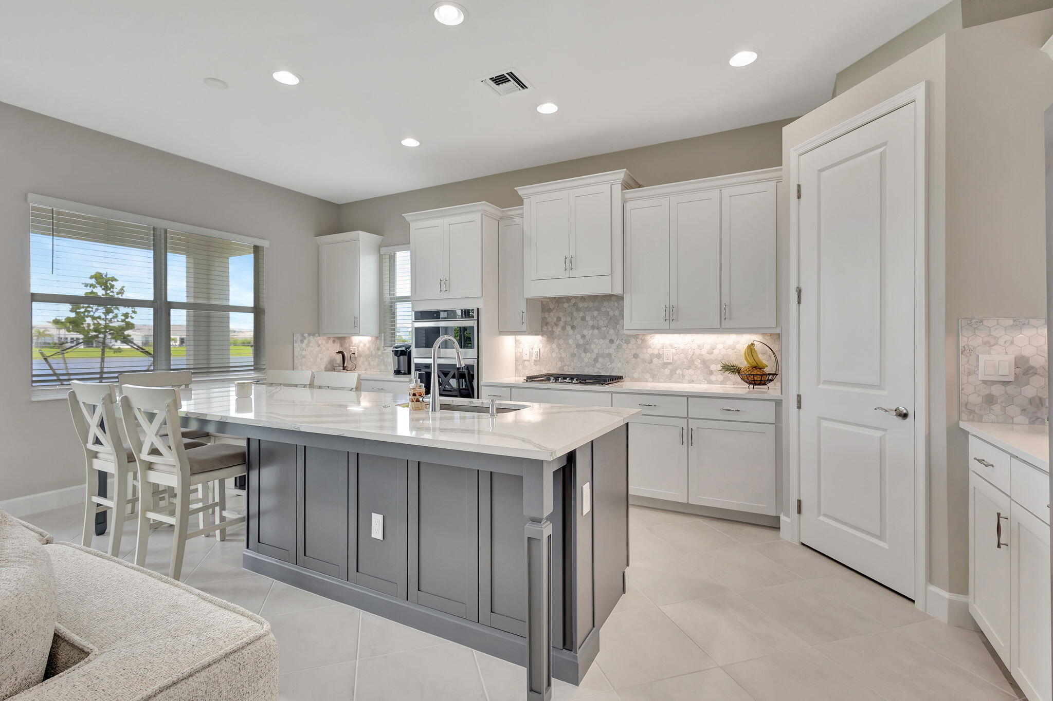 5403 Macoon Way Westlake, FL 33470 - Photo 7 of 51 a kitchen with a sink and cabinets