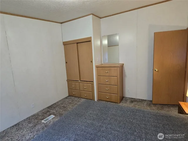 a room with closet and mirror