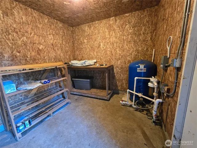 a living room with a fireplace and a table