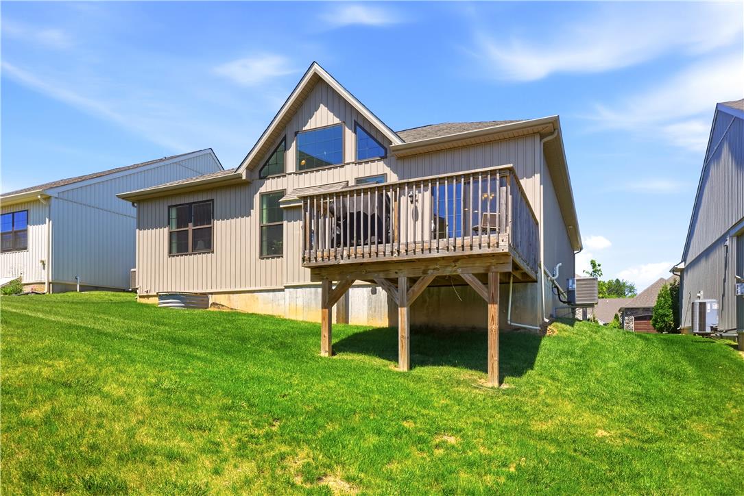 4120 Eveningstar Road Emmaus, PA 18049 - Photo 52 of 62 A spacious backyard with a private deck extends the living space outdoors, perfect for enjoyment.