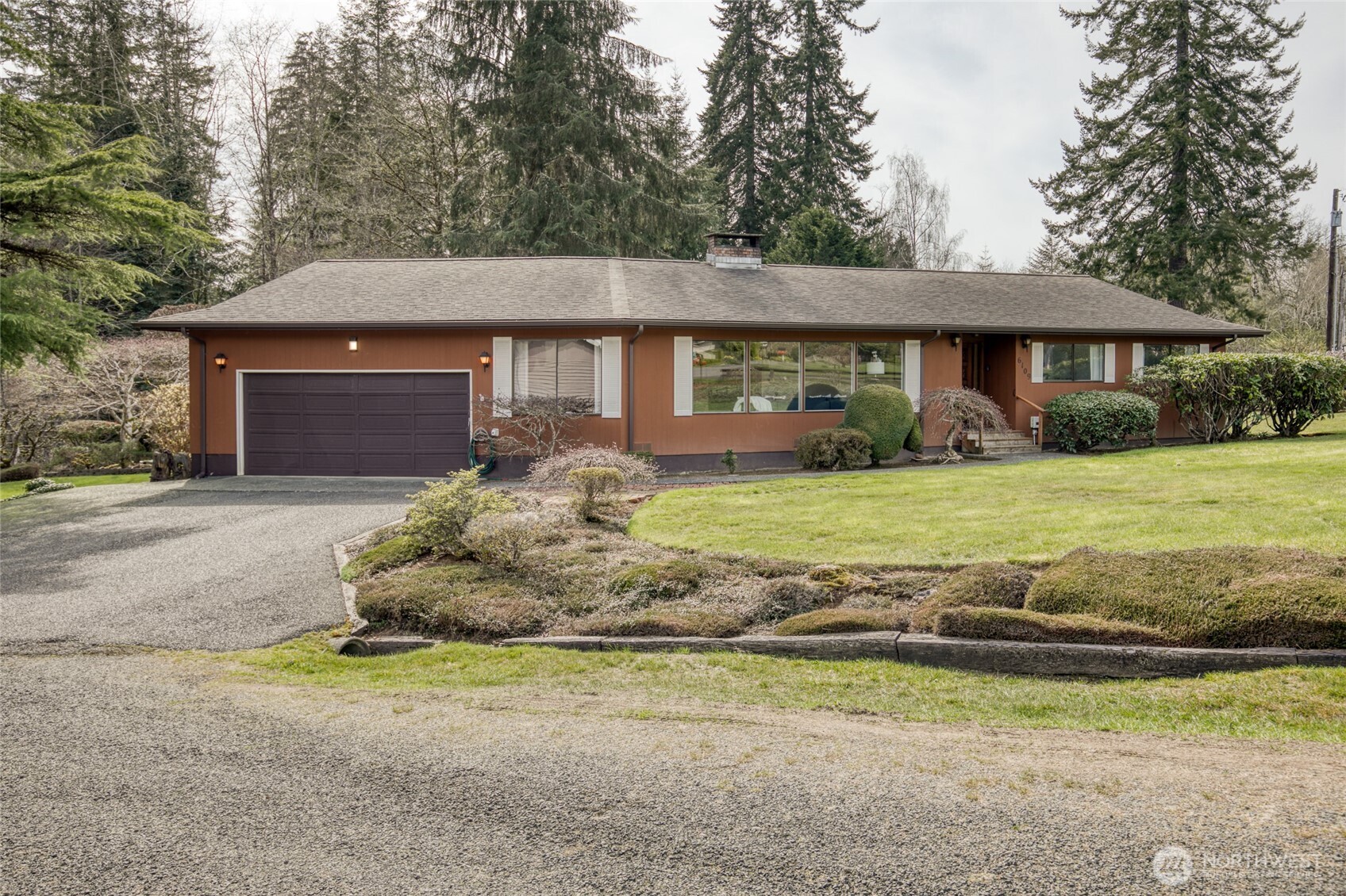 6109 Ridgeview Drive Aberdeen, WA 98520 - Photo 2 of 38 a front view of a house with a yard