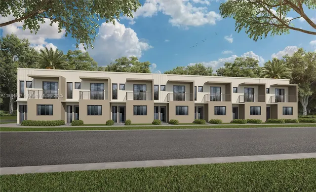 a front view of a house with a garden and trees