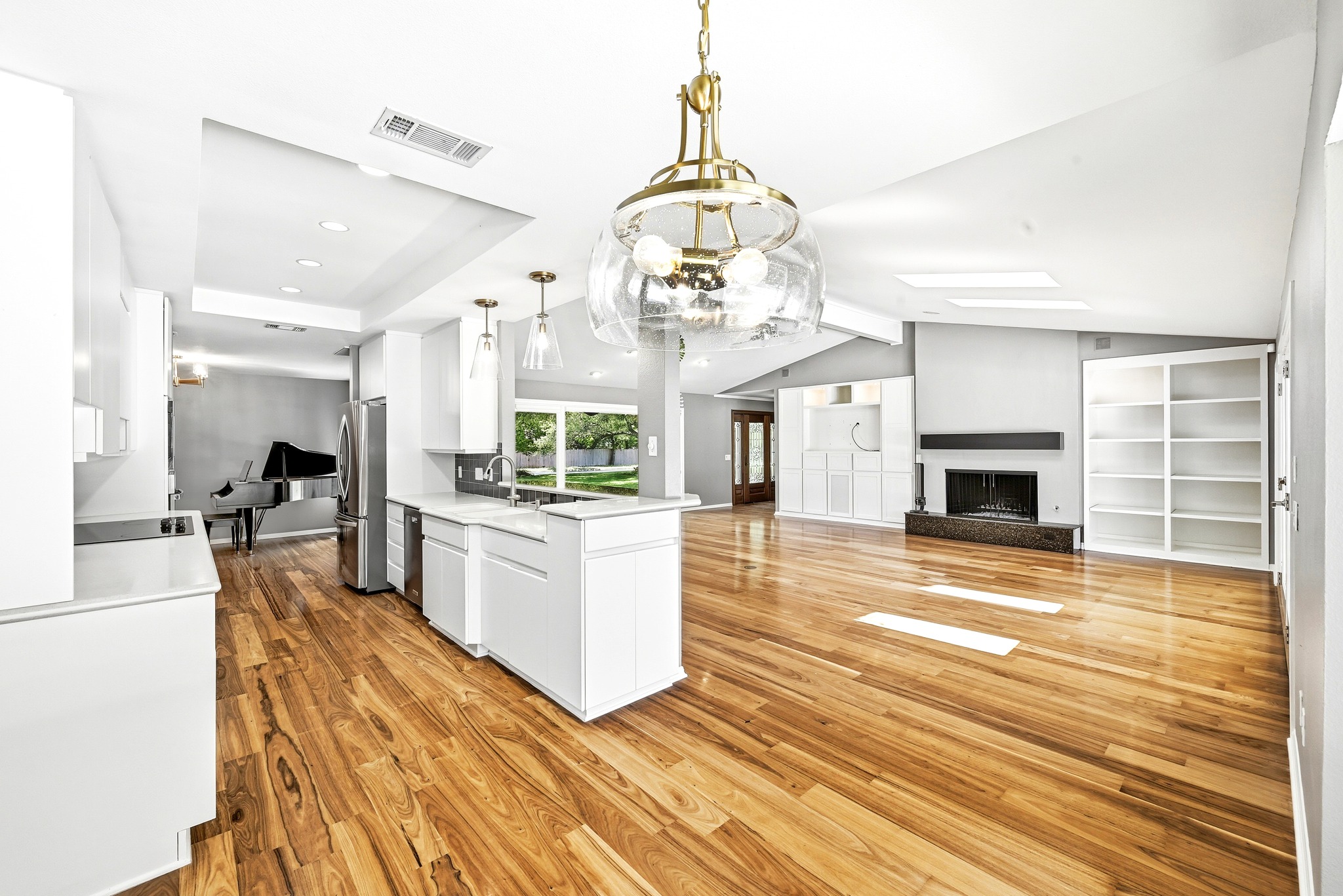 8608 Crest Ridge Circle Austin, TX 78750 - Photo 11 of 38 Natural light dances across polished hardwood floors in this spacious, open-concept living area.