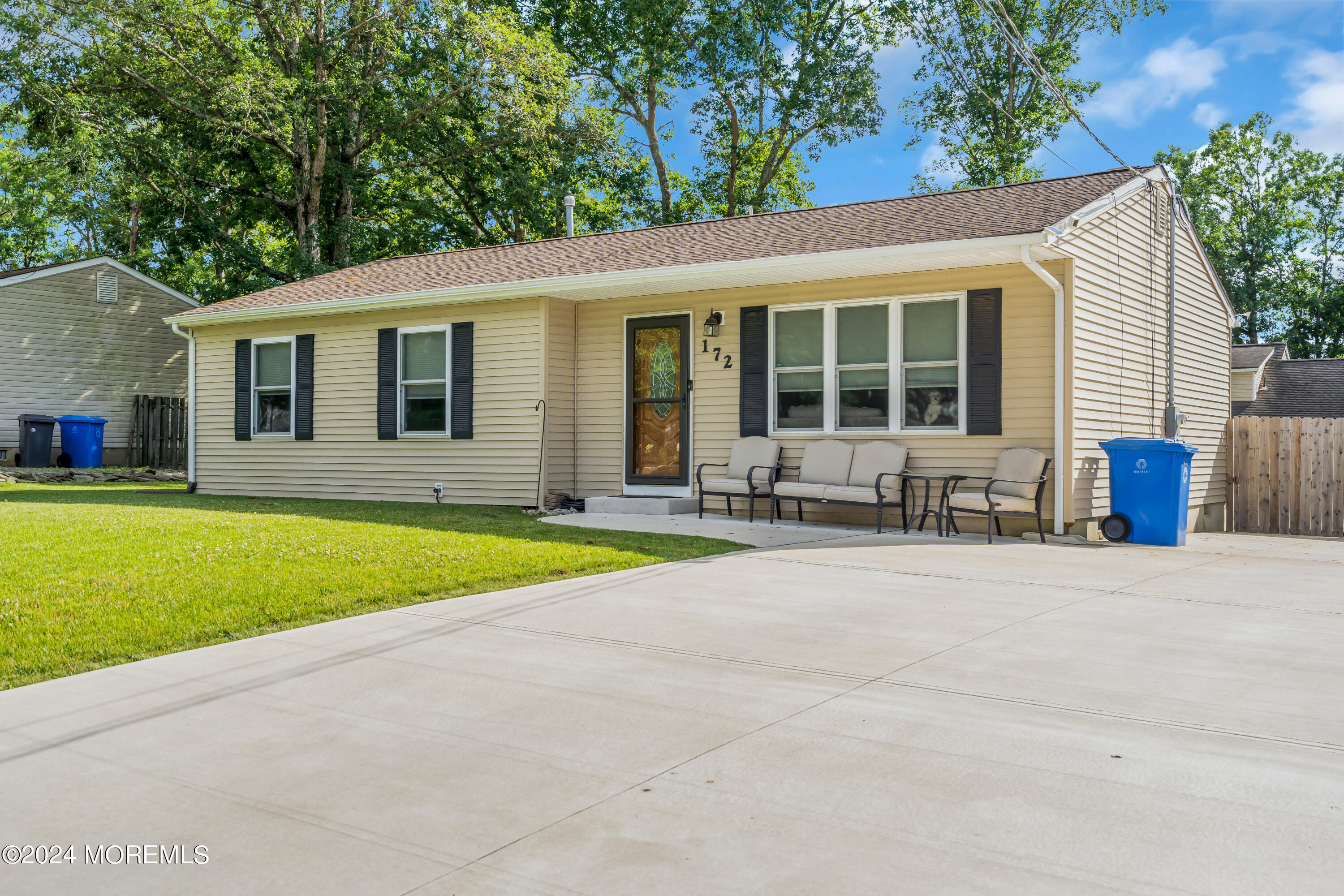 172 Stowaway Road Manahawkin, NJ 08050 - Photo 1 of 36 a front view of house with yard and green space
