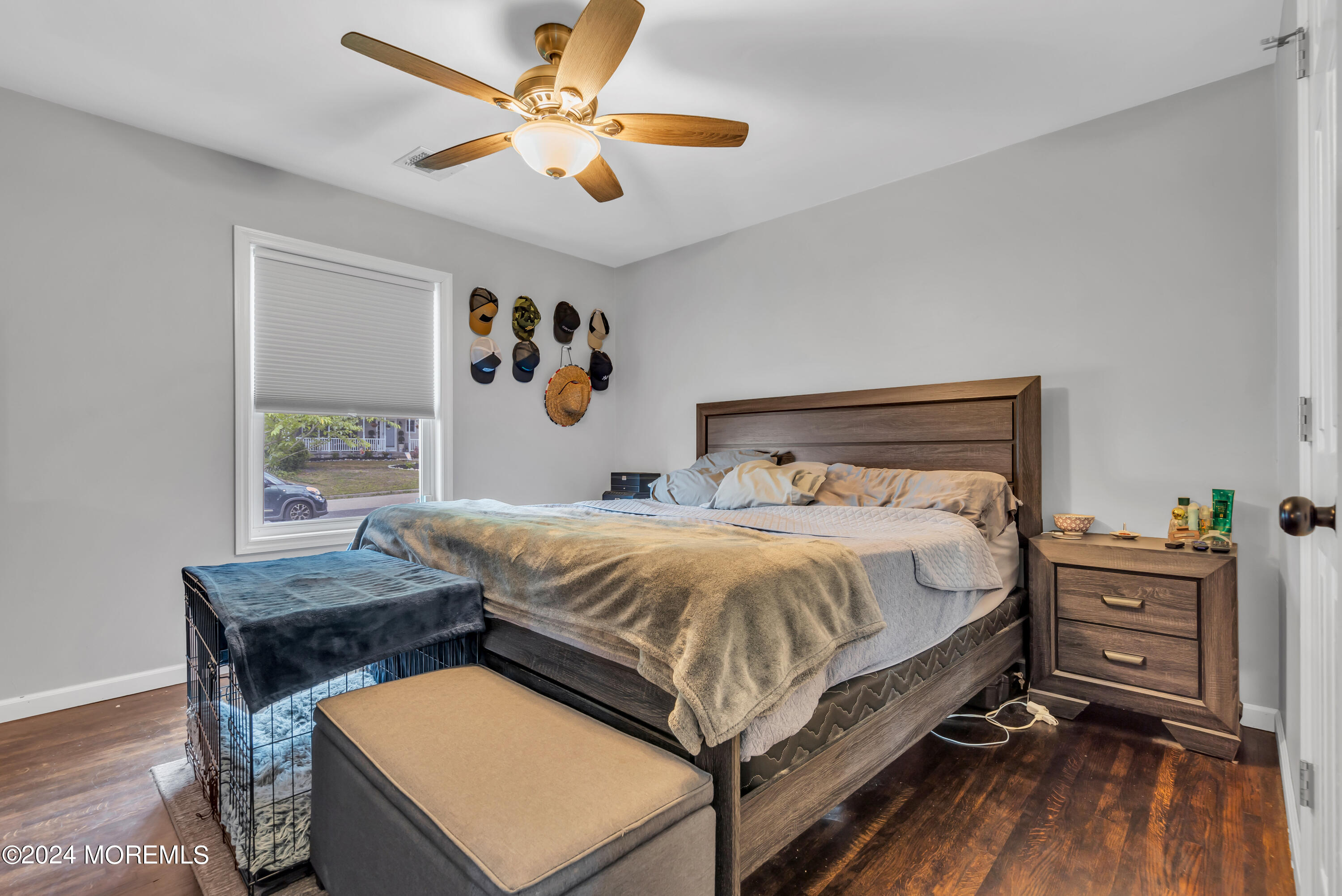172 Stowaway Road Manahawkin, NJ 08050 - Photo 18 of 36 a bedroom with a bed and a table in it