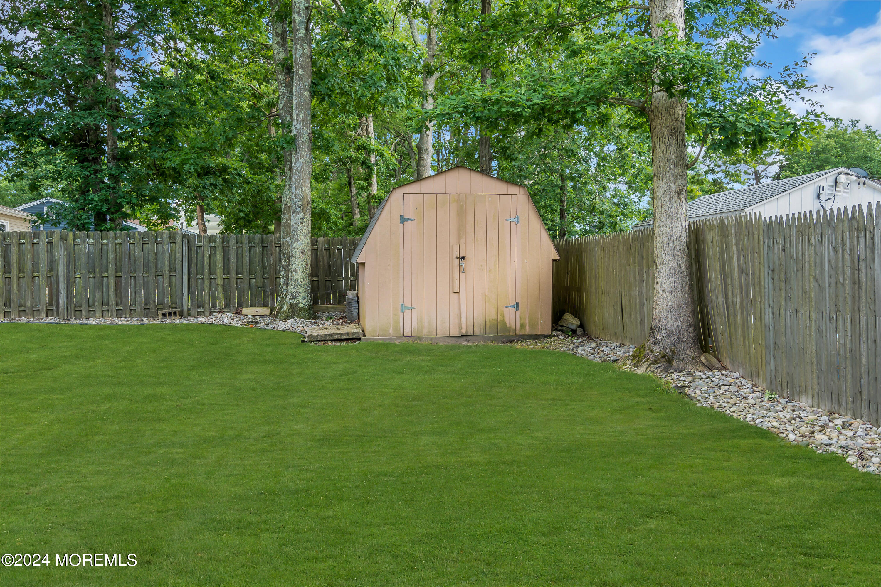 172 Stowaway Road Manahawkin, NJ 08050 - Photo 25 of 36 a view of backyard with green space and wooden fence