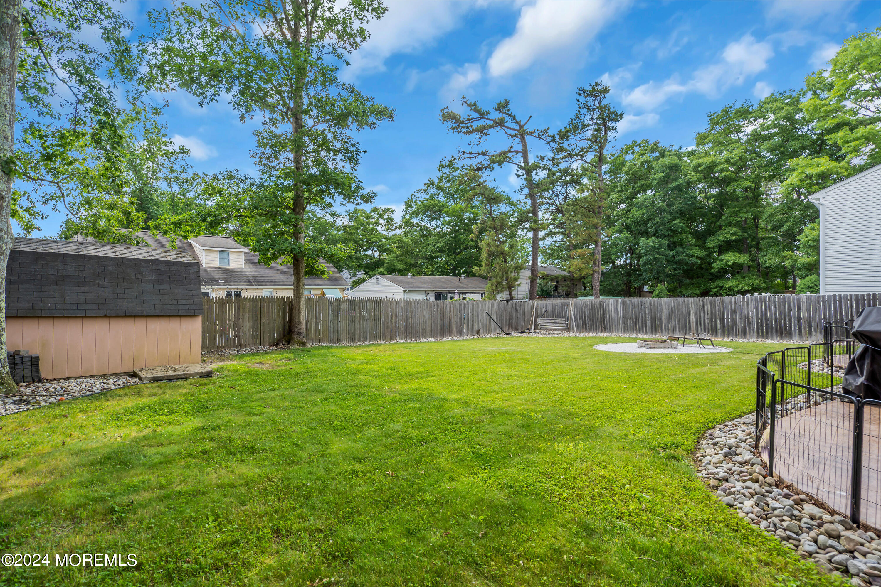 172 Stowaway Road Manahawkin, NJ 08050 - Photo 28 of 36 a view of a backyard with a garden