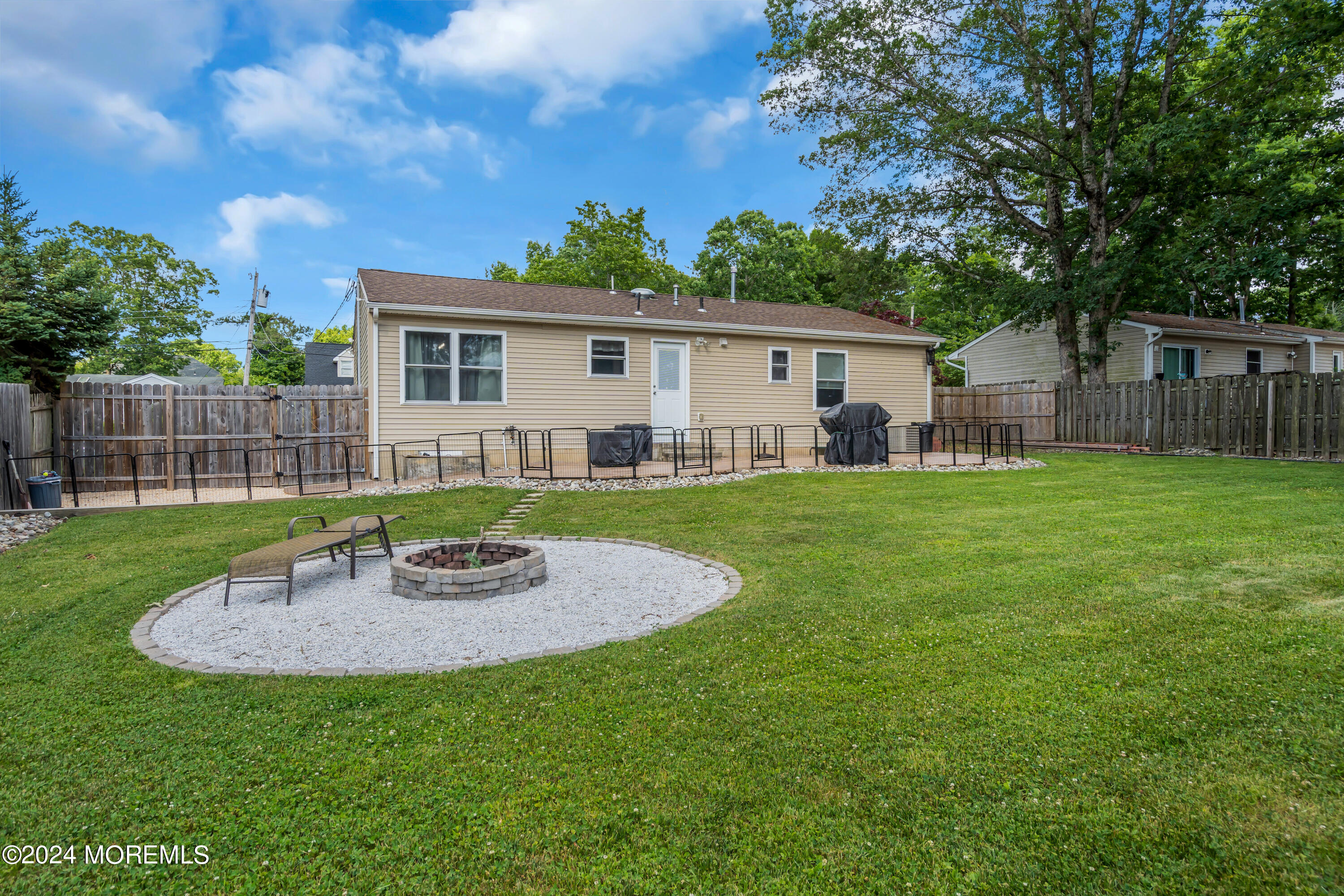 172 Stowaway Road Manahawkin, NJ 08050 - Photo 29 of 36 a view of a house with a yard porch and sitting area