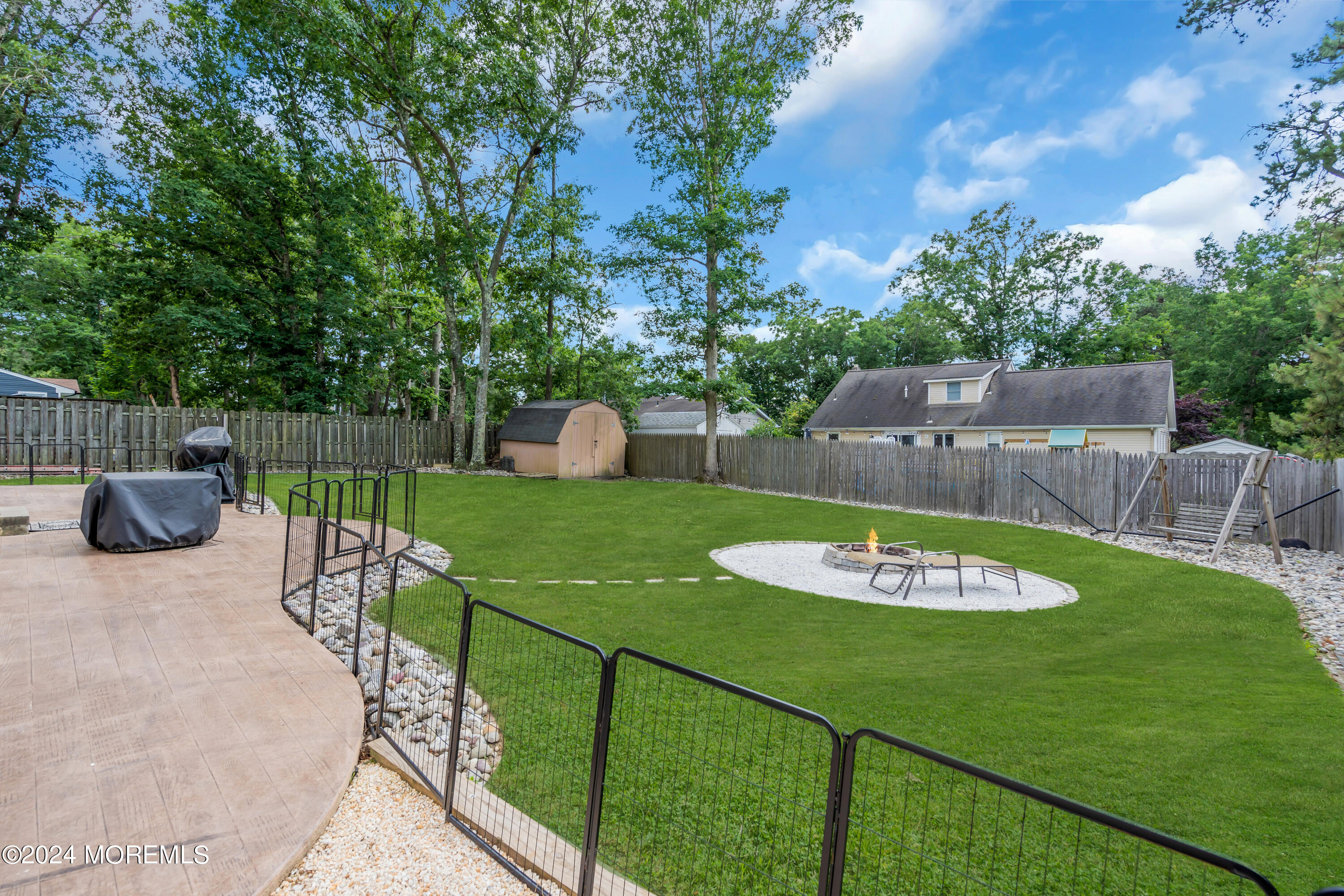 172 Stowaway Road Manahawkin, NJ 08050 - Photo 34 of 36 a view of a backyard with sitting area