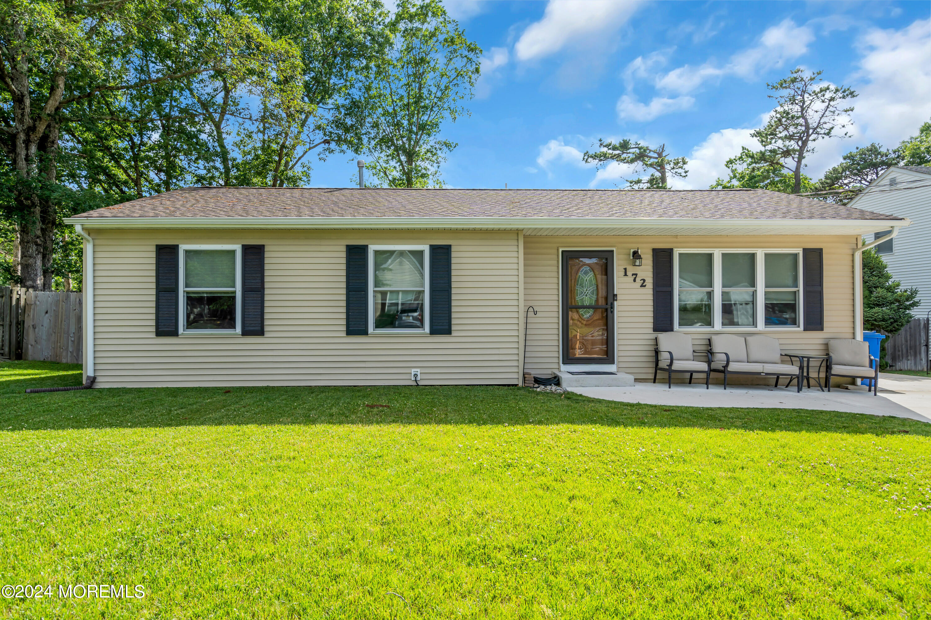 172 Stowaway Road Manahawkin, NJ 08050 - Photo 4 of 36 a view of a house with a backyard porch and sitting area