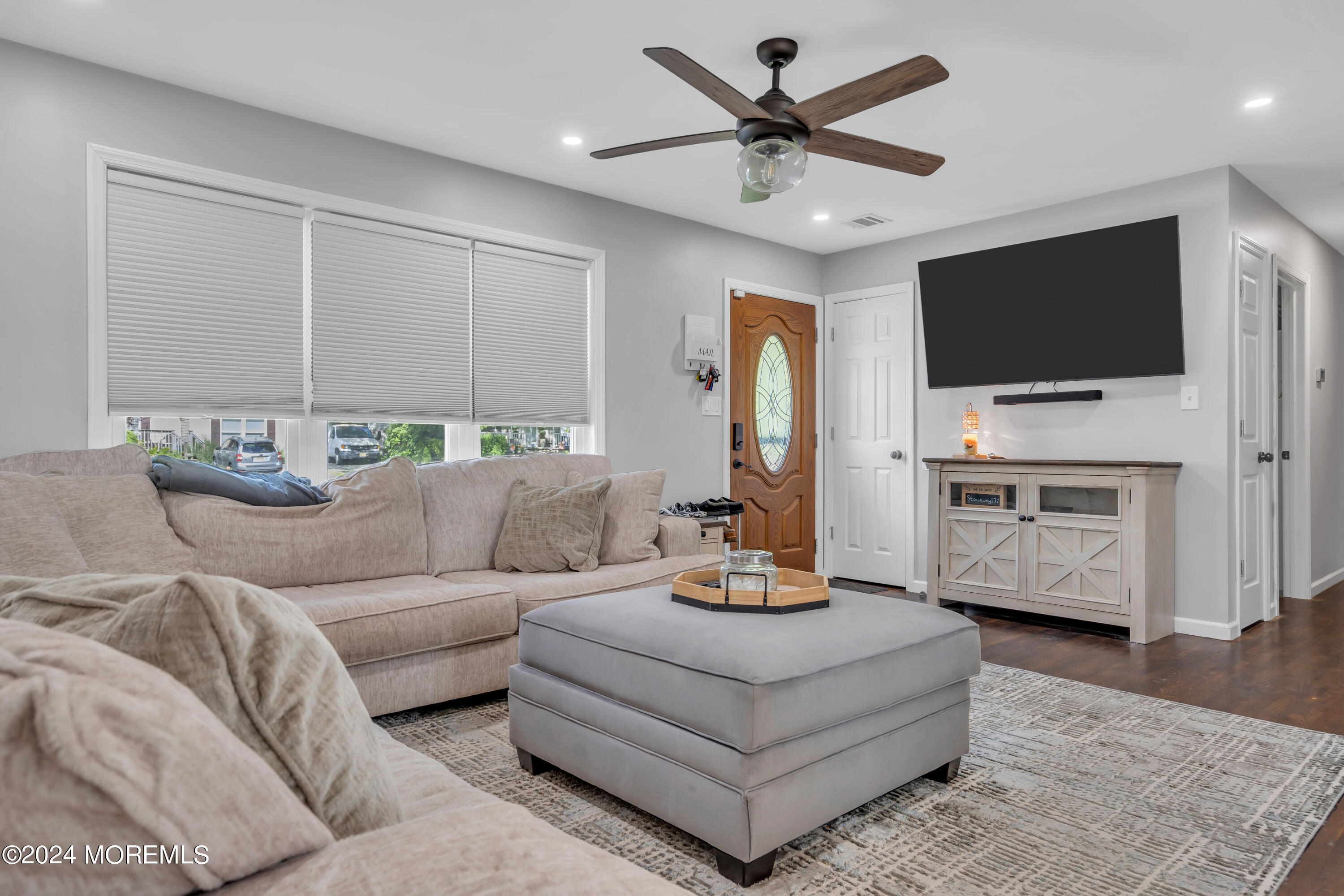 172 Stowaway Road Manahawkin, NJ 08050 - Photo 7 of 36 a living room with furniture and a flat screen tv