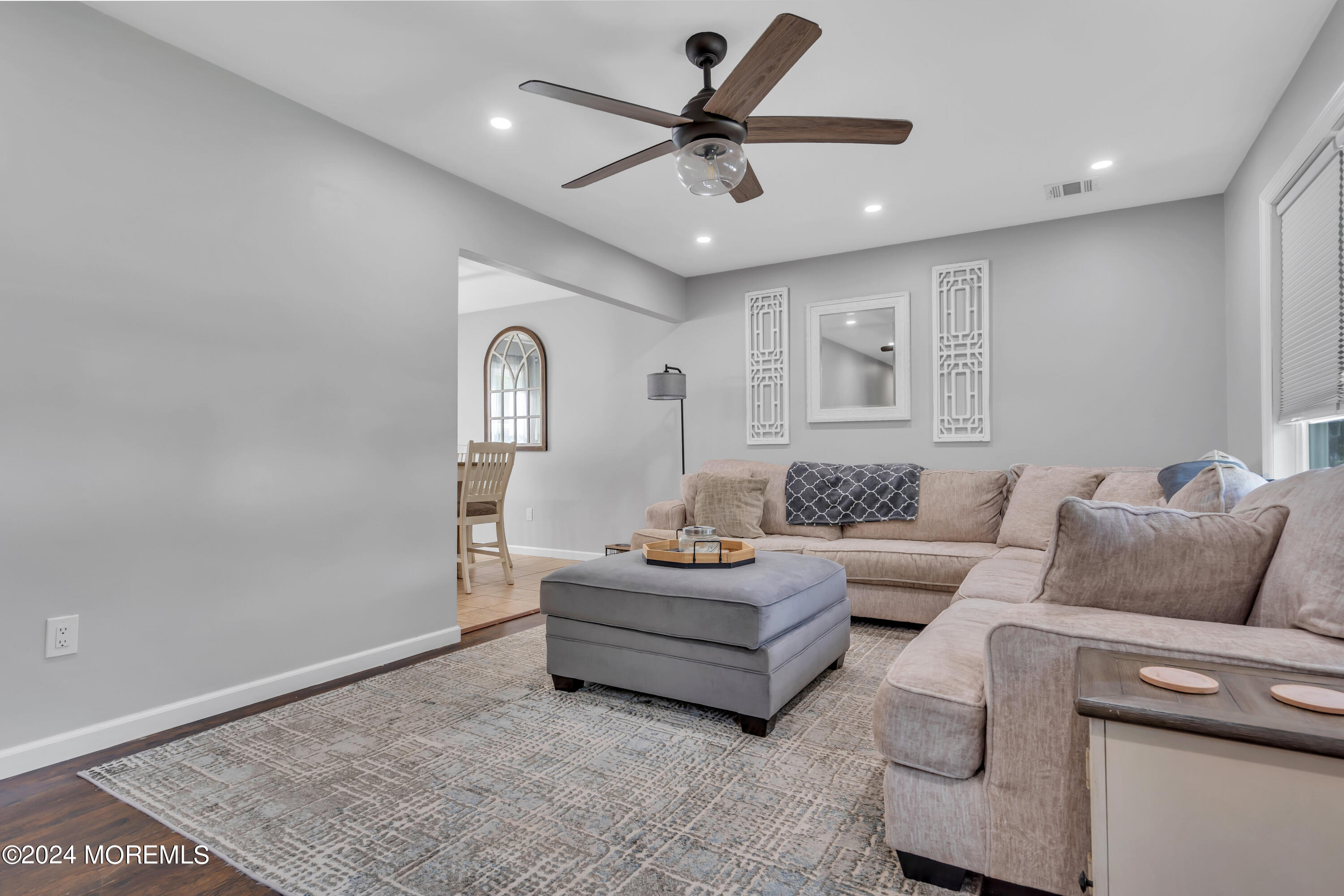 172 Stowaway Road Manahawkin, NJ 08050 - Photo 8 of 36 a living room with furniture and a ceiling fan