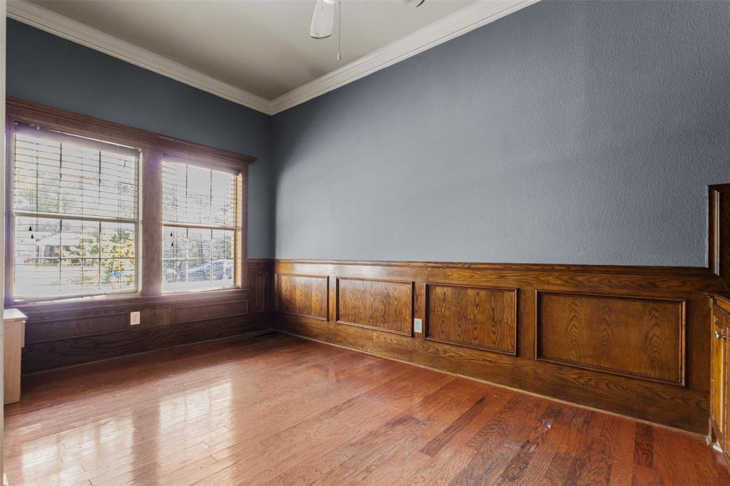 490 Lynne Drive Rockwall, TX 75032 - Photo 17 of 27 Unfurnished room with crown molding, hardwood / wood-style floors, a wainscoted wall, and ceiling fan