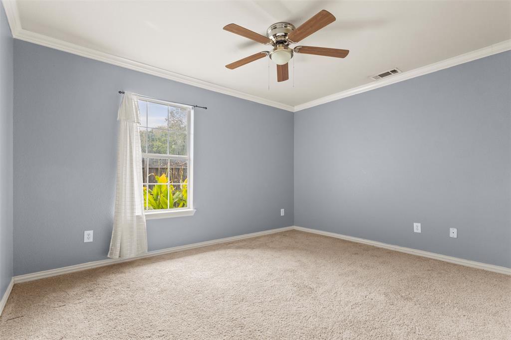 490 Lynne Drive Rockwall, TX 75032 - Photo 22 of 27 Spare room with crown molding, carpet floors, and a ceiling fan