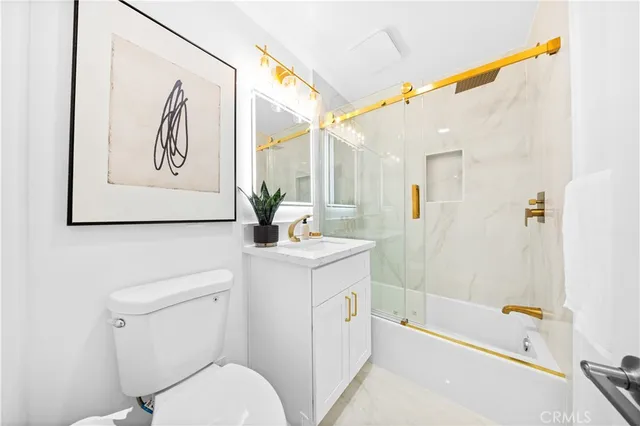 a bathroom with a sink a toilet and a bathtub