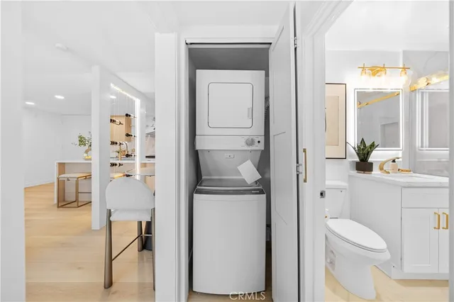 a bathroom with a toilet a sink and a mirror