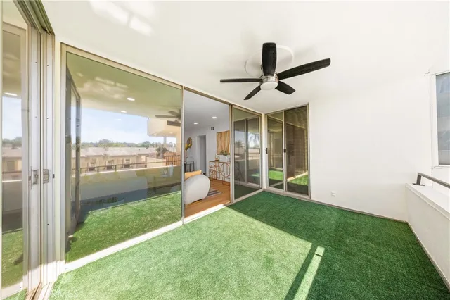 a view of a porch in front of a house with a yard