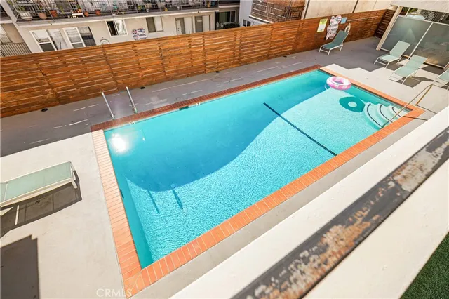 a view of a two chairs in the balcony