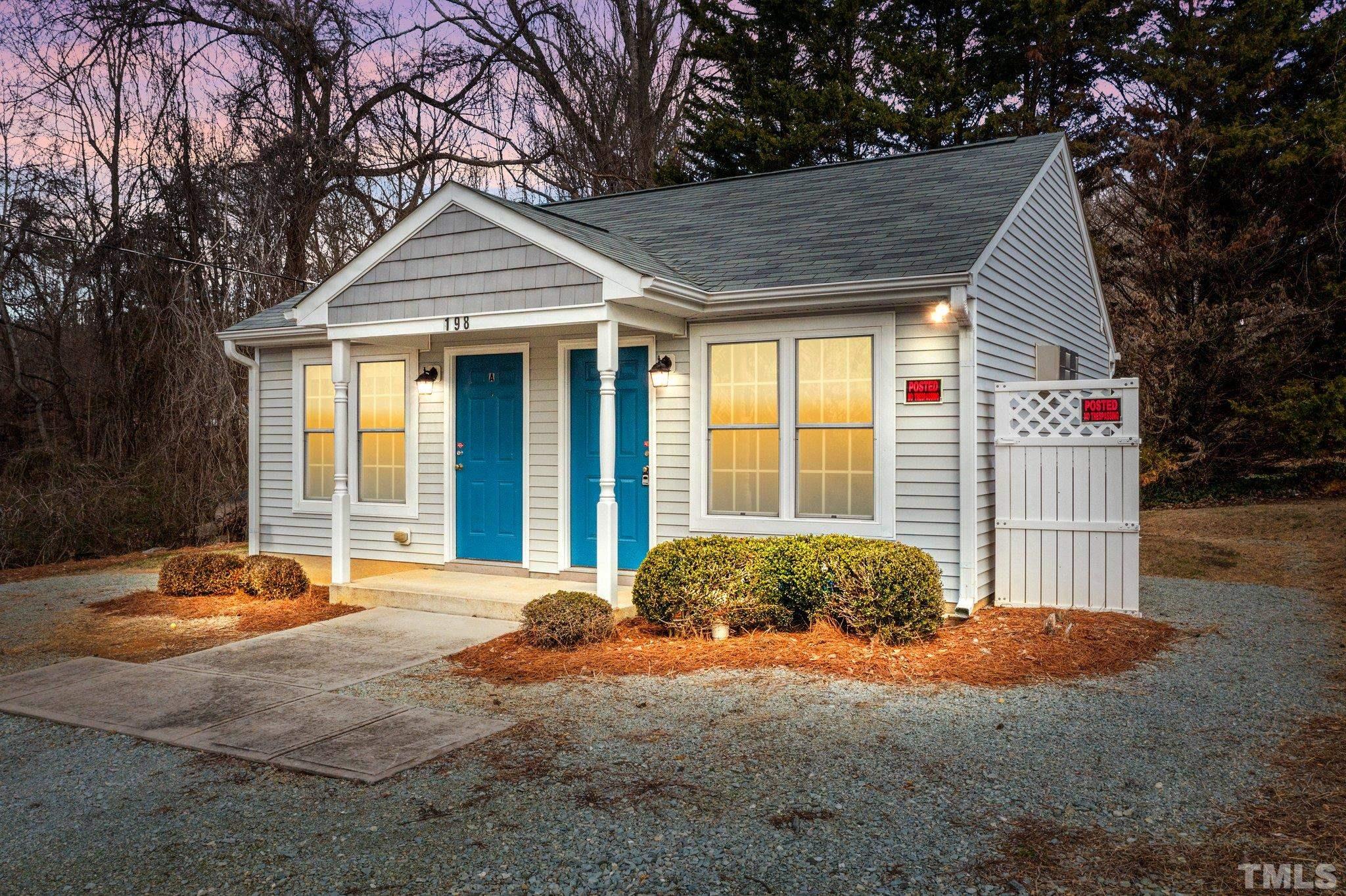 198 Garrett Street Roxboro, NC 27573 - Photo 1 of 17 a front view of a house with a garage