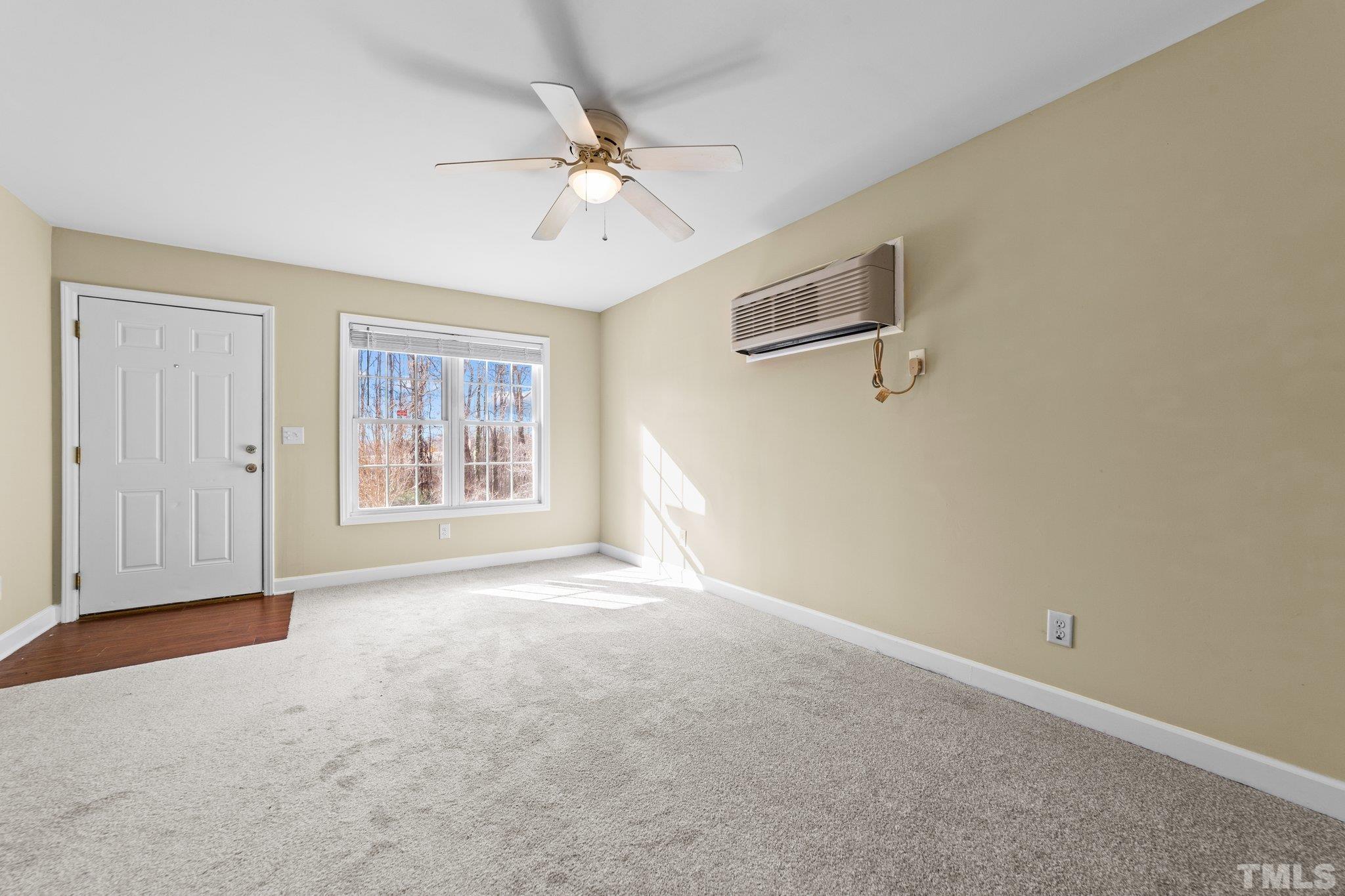 198 Garrett Street Roxboro, NC 27573 - Photo 15 of 17 an empty room with windows and fan view