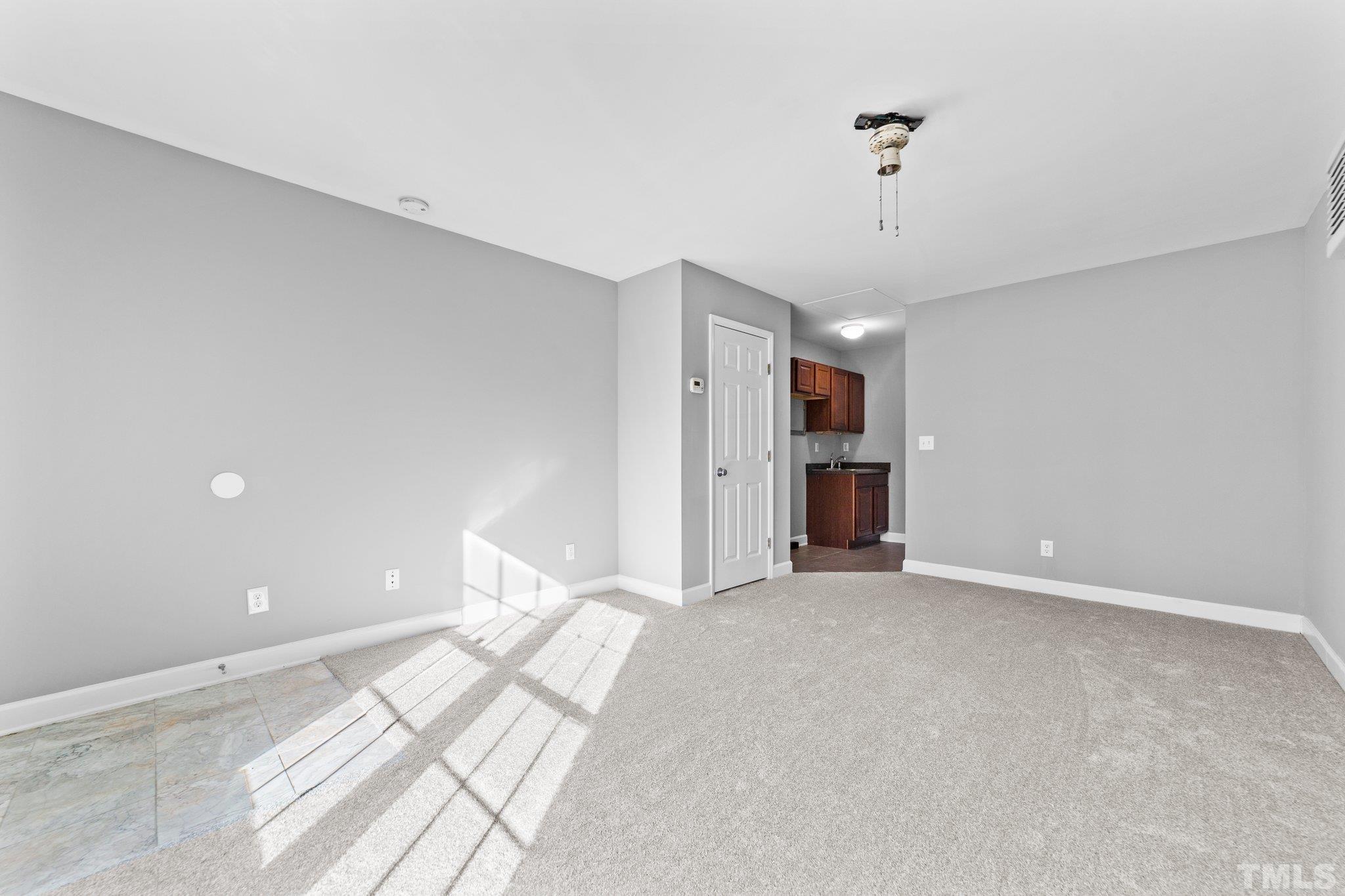 198 Garrett Street Roxboro, NC 27573 - Photo 6 of 17 a view of an empty room with a window
