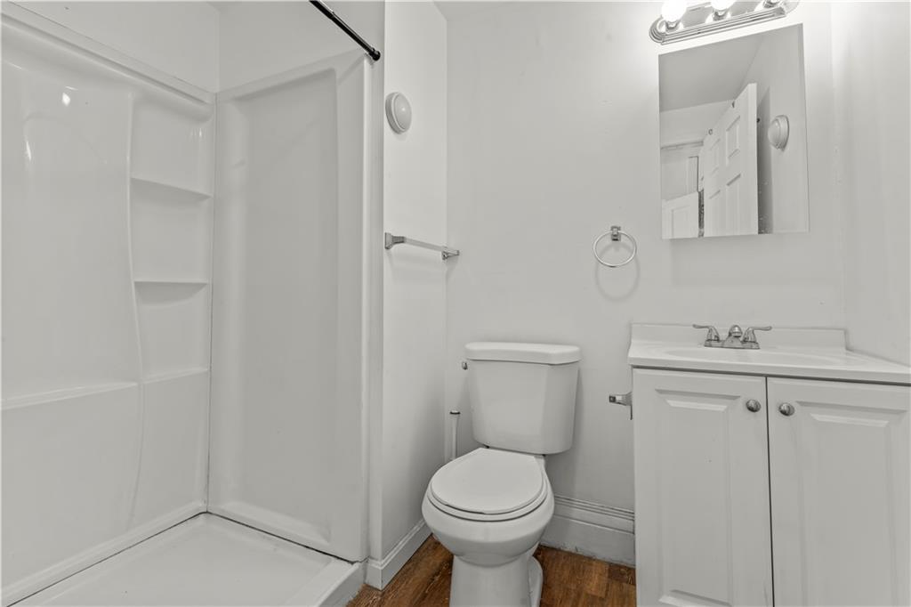 1877 Chapman Street Pittsburgh, PA 15215 - Photo 20 of 28 a bathroom with a sink toilet and vanity