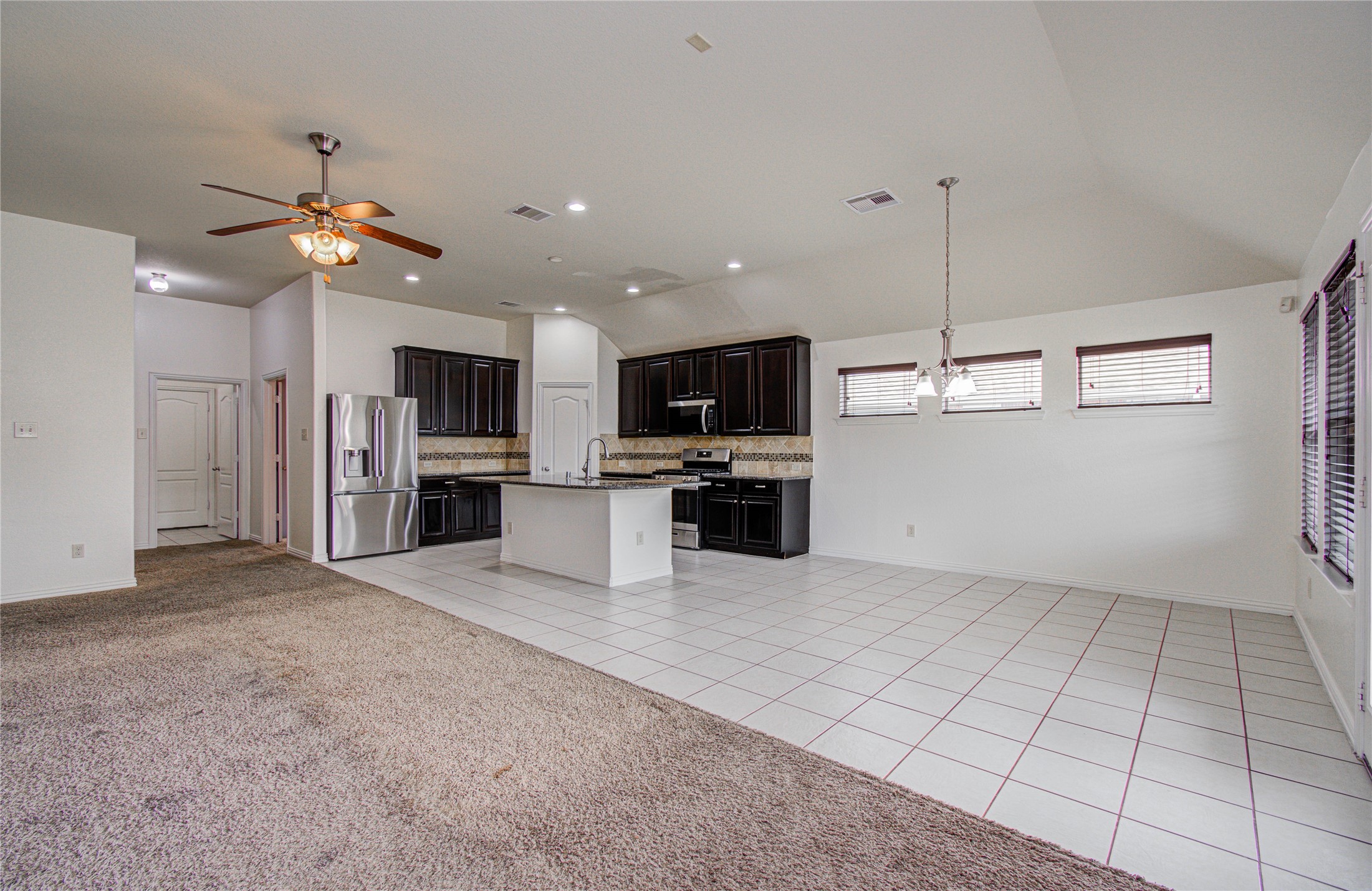 17702 Jacobs Ladder Court Tomball, TX 77377 - Photo 12 of 36 a view of kitchen with microwave and refrigerator