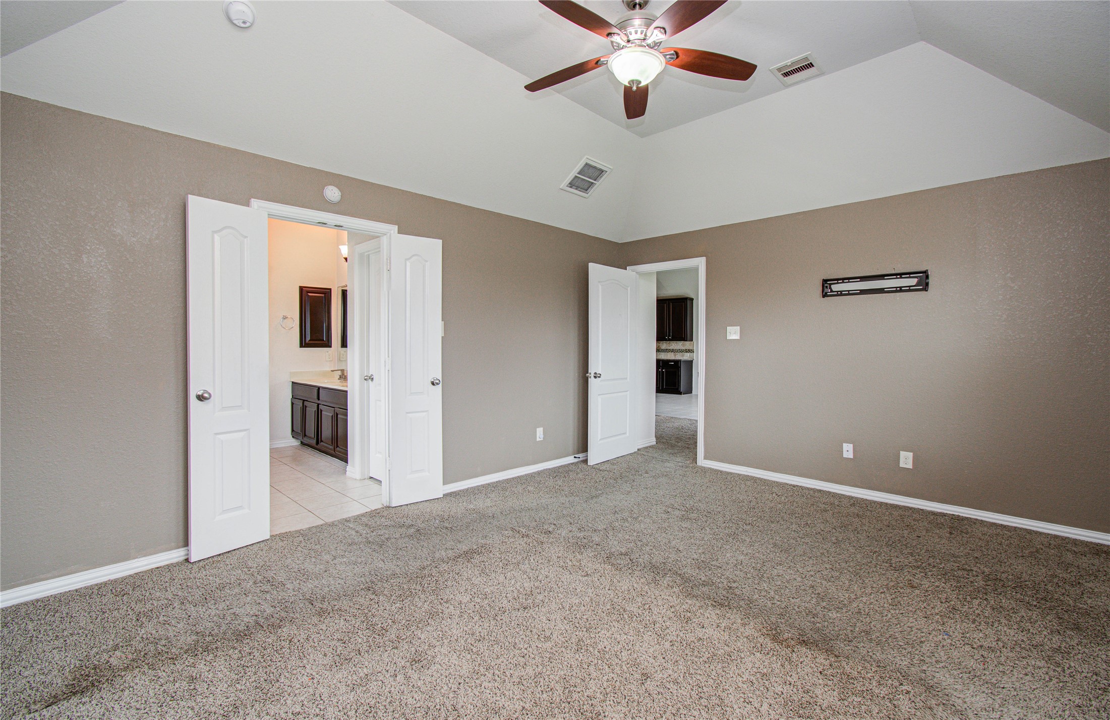 17702 Jacobs Ladder Court Tomball, TX 77377 - Photo 19 of 36 a view of a big room with a chandelier fan and windows