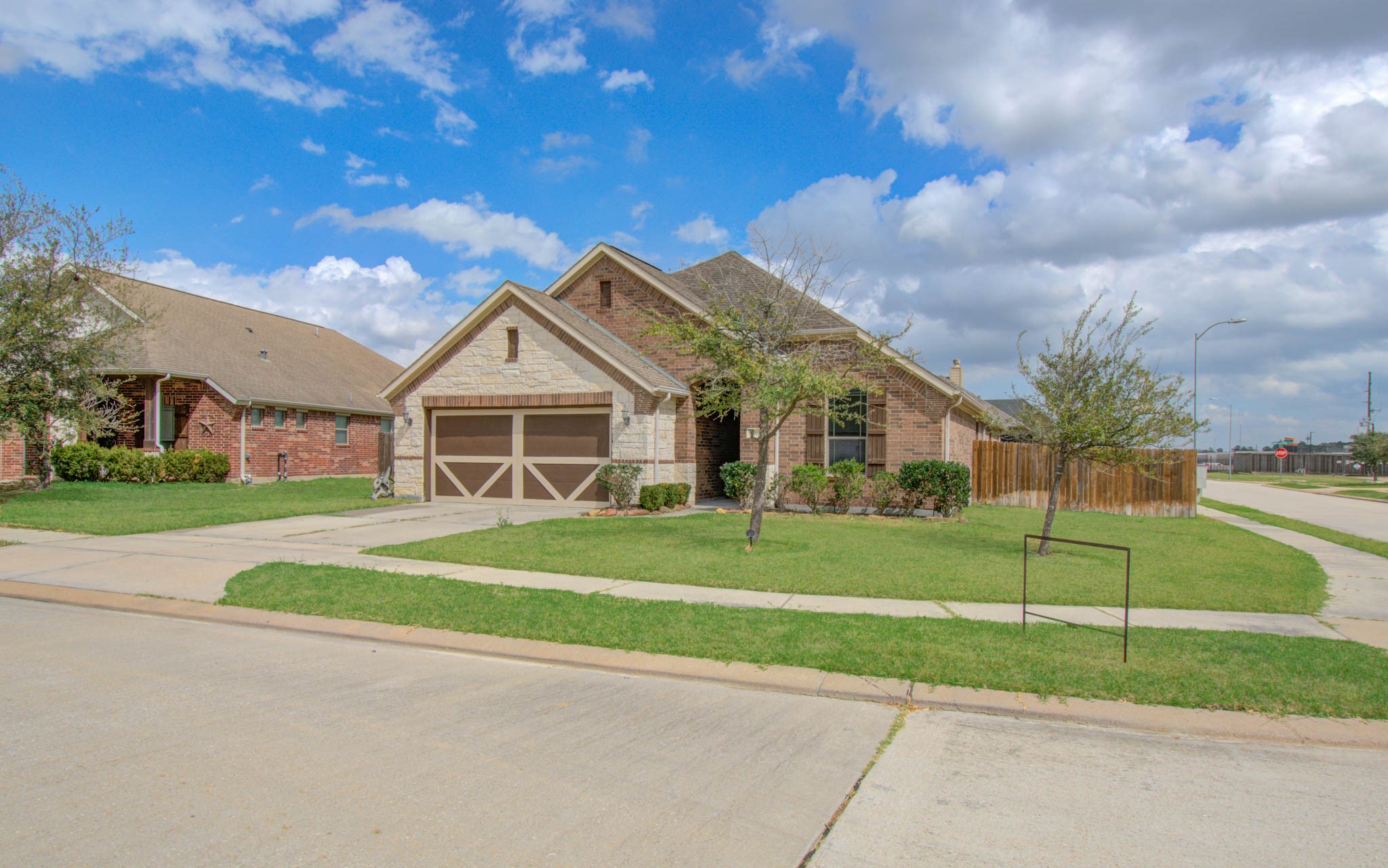 17702 Jacobs Ladder Court Tomball, TX 77377 - Photo 2 of 36 a front view of a house with a yard