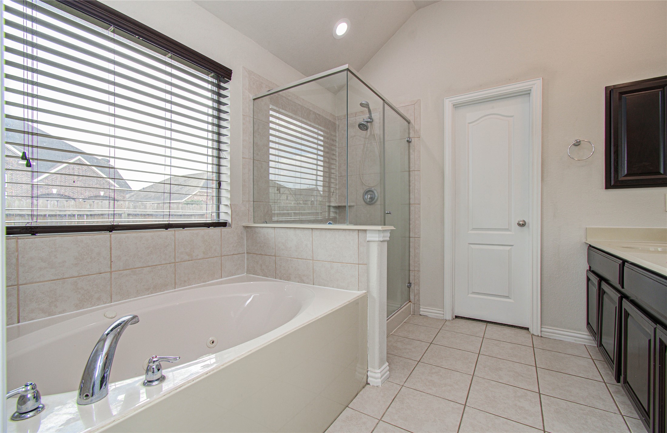 17702 Jacobs Ladder Court Tomball, TX 77377 - Photo 31 of 36 a bathroom with a bathtub and a shower