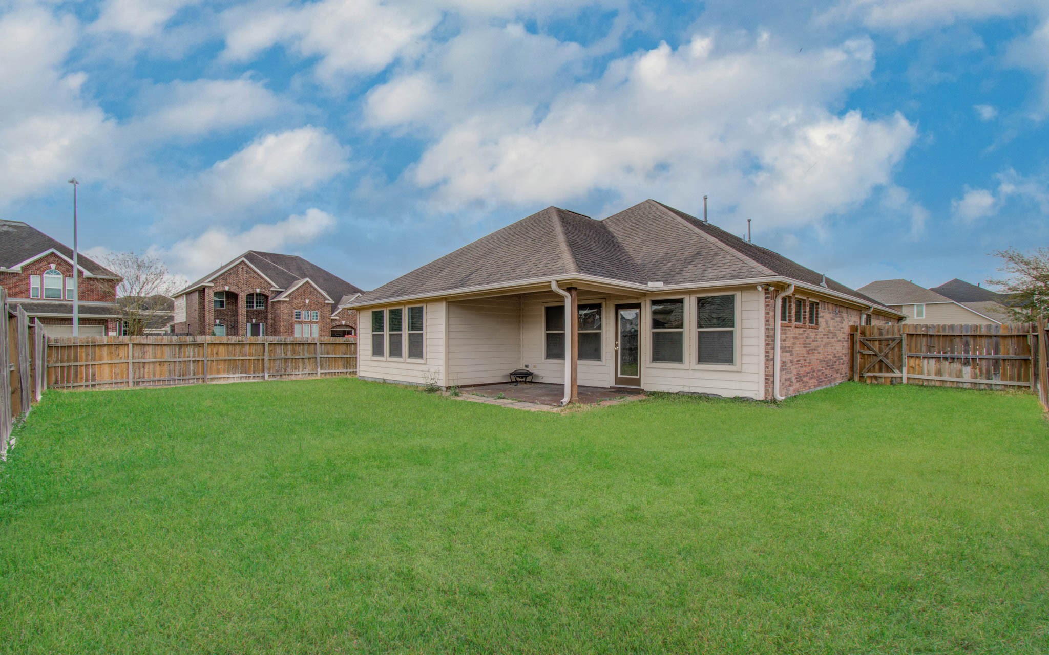 17702 Jacobs Ladder Court Tomball, TX 77377 - Photo 35 of 36 a view of a house with a big yard