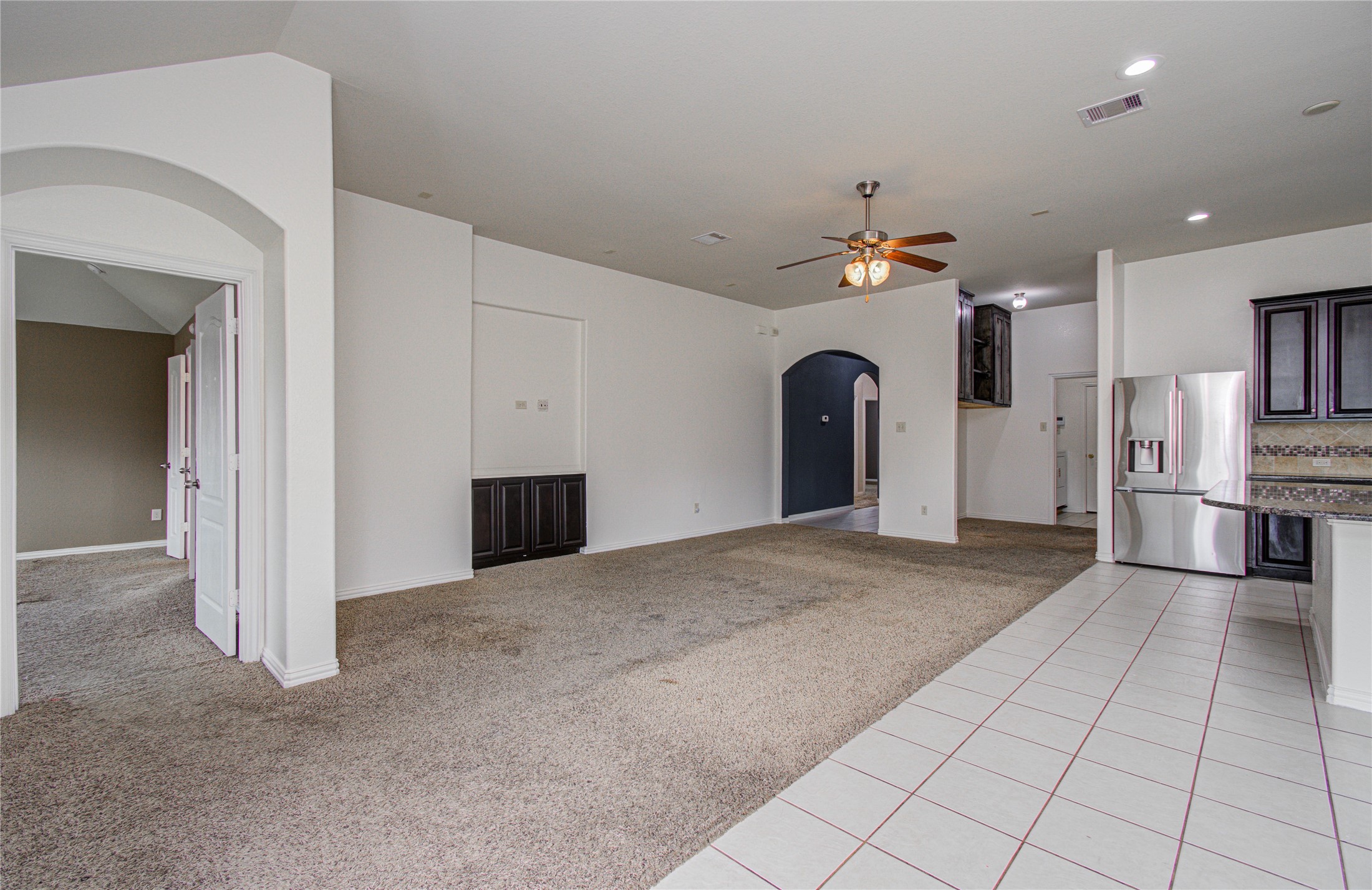 17702 Jacobs Ladder Court Tomball, TX 77377 - Photo 8 of 36 a view of a kitchen with a sink and a living room