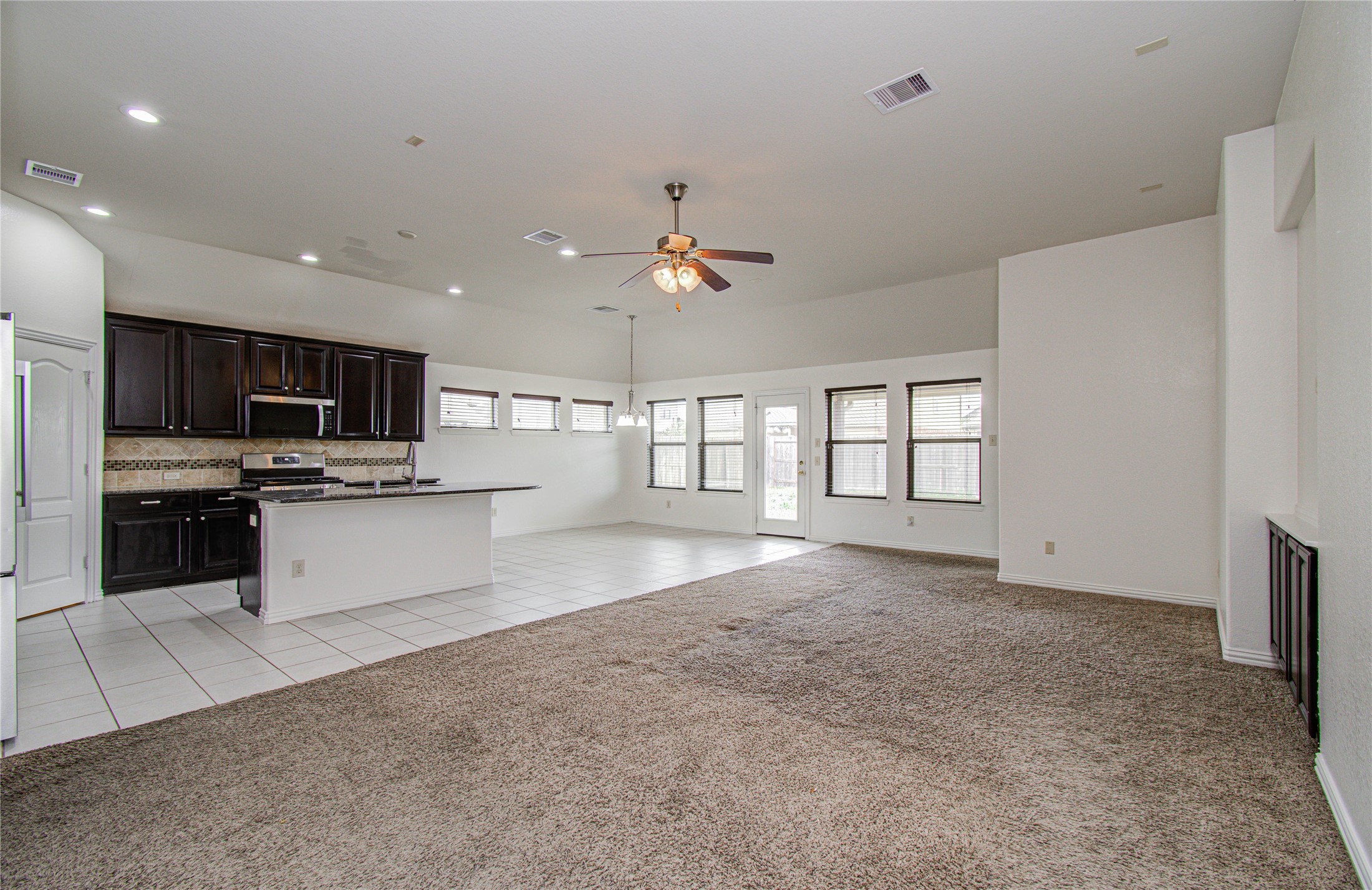 17702 Jacobs Ladder Court Tomball, TX 77377 - Photo 9 of 36 a large kitchen with cabinets