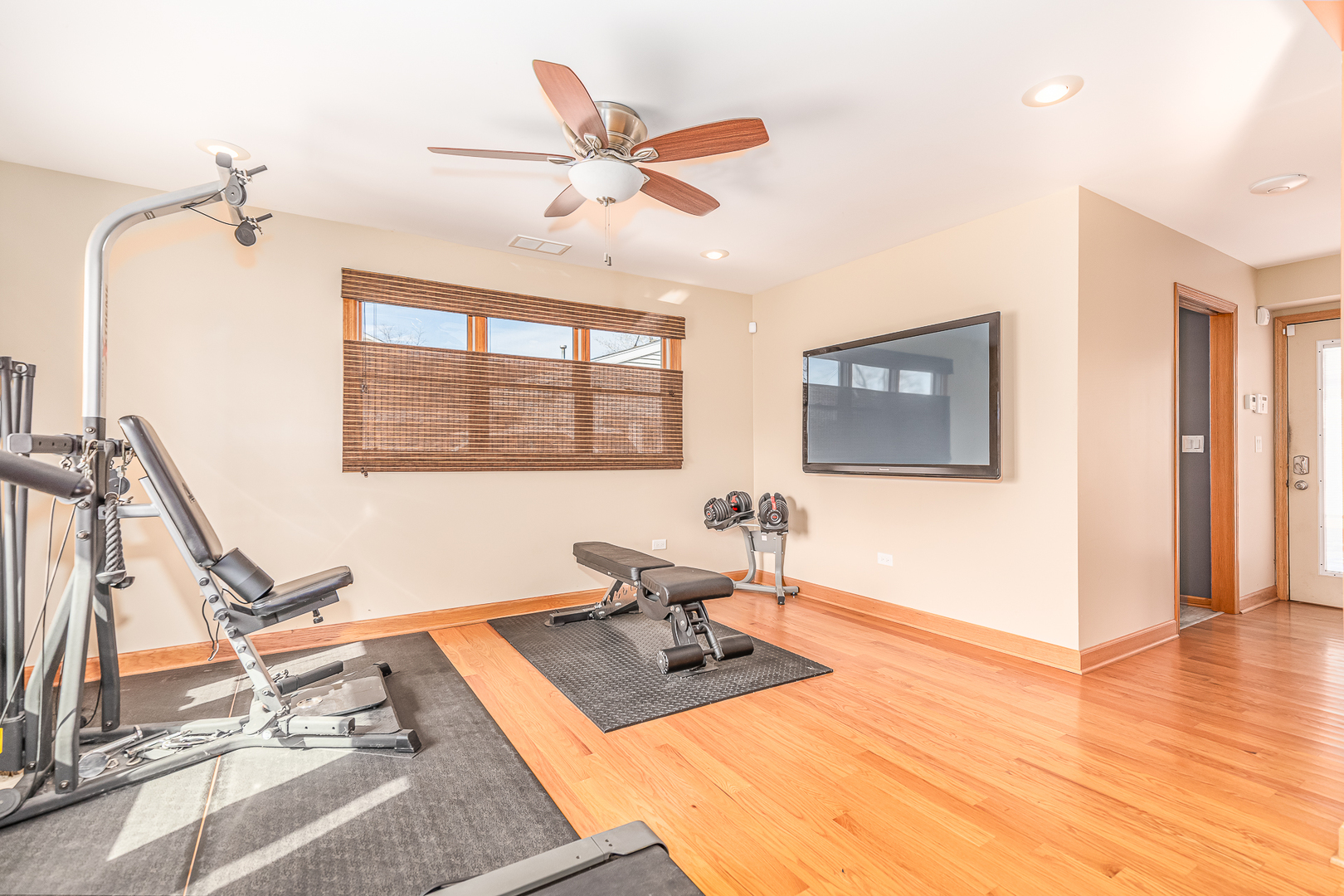 181 Queenswood Road Bolingbrook, IL 60440 - Photo 17 of 46 a living room with a large window wooden floor and chandelier