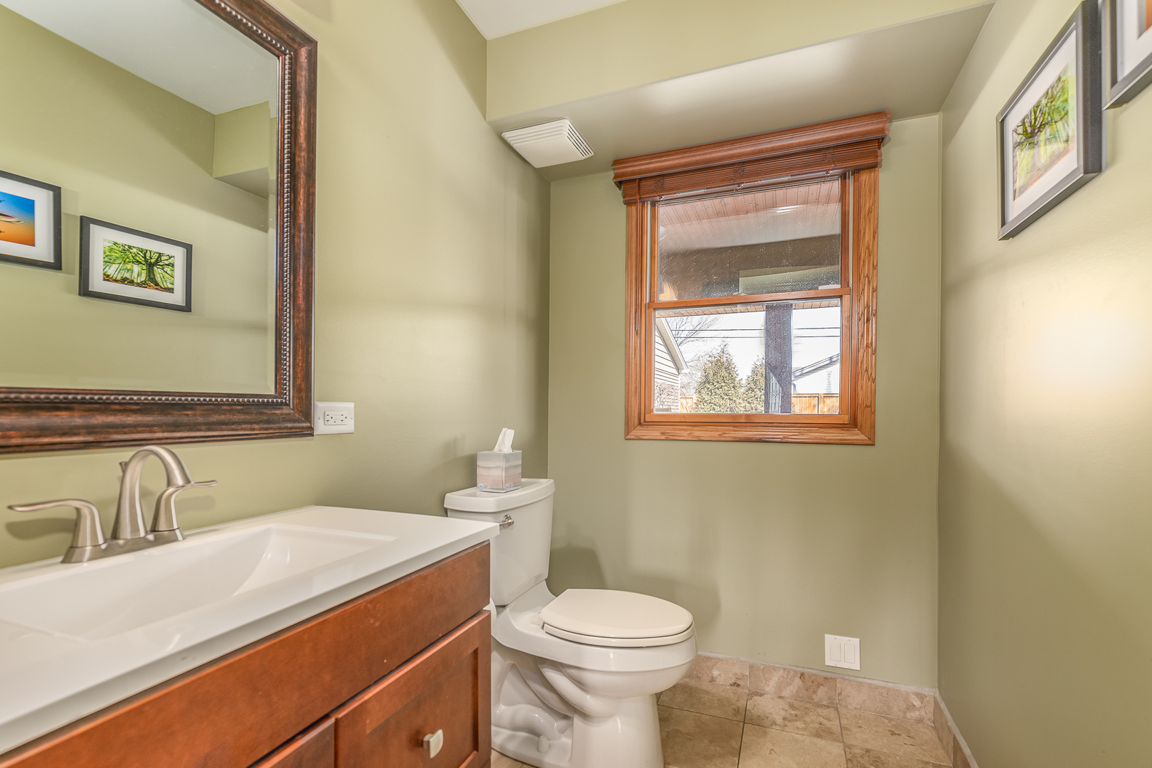 181 Queenswood Road Bolingbrook, IL 60440 - Photo 20 of 46 a bathroom with a sink a toilet and mirror
