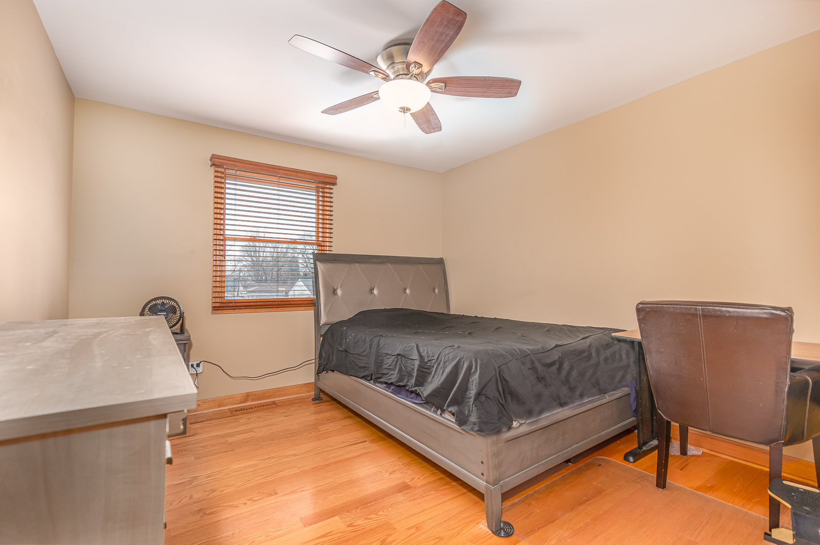 181 Queenswood Road Bolingbrook, IL 60440 - Photo 21 of 46 a living room with a bed furniture and a window