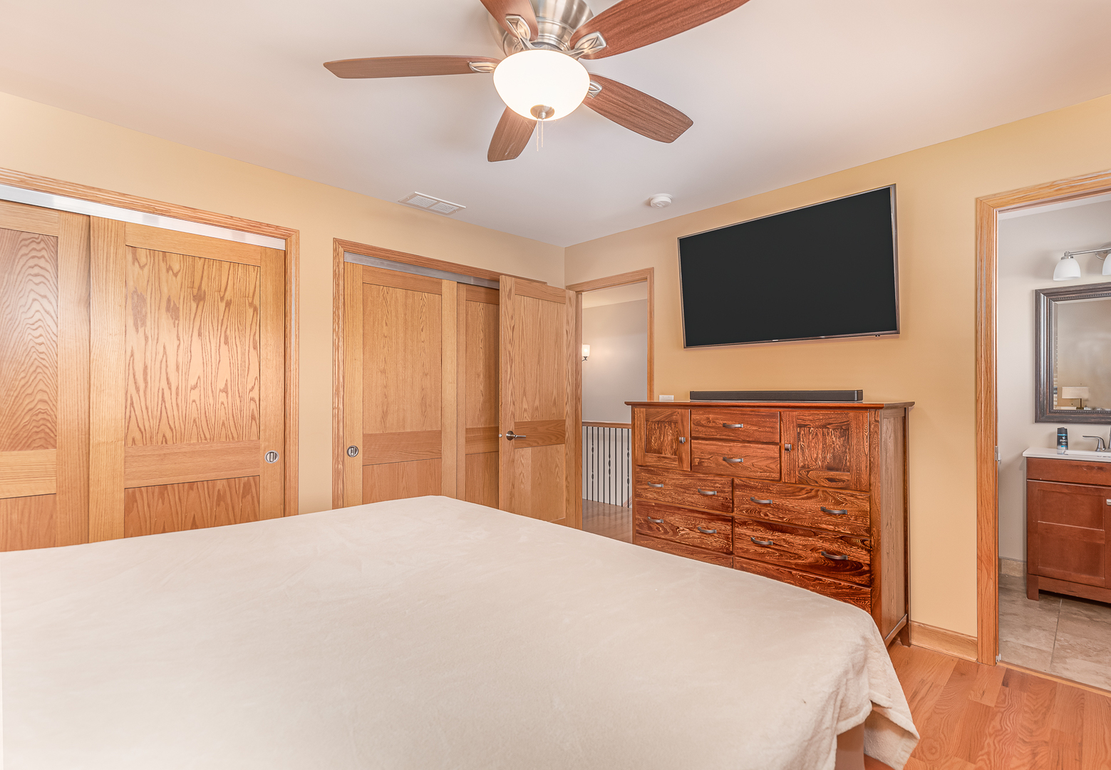 181 Queenswood Road Bolingbrook, IL 60440 - Photo 26 of 46 a bedroom with a bed and a flat screen tv