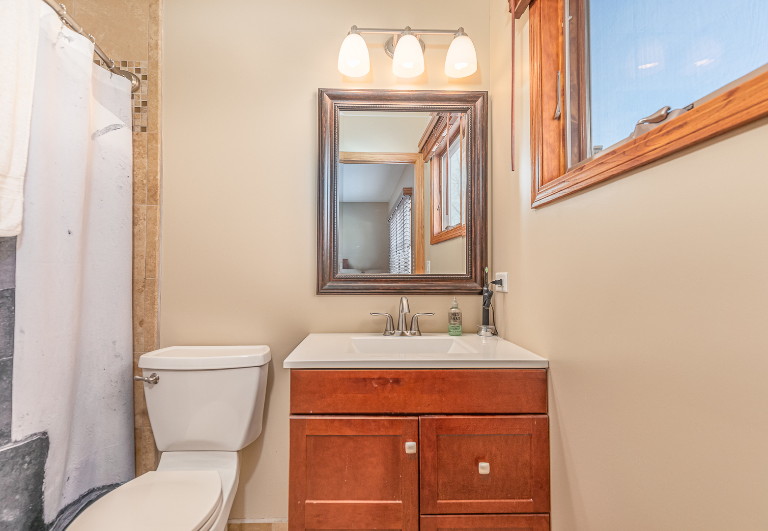 181 Queenswood Road Bolingbrook, IL 60440 - Photo 27 of 46 a bathroom with a toilet a sink and mirror